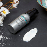 Apothaka comforting moisturiser in aluminium bottle and pump dispenser, fragrance free with texture shown