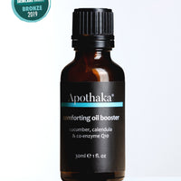 Award winning Apothaka comforting oil booster fragrance free for sensitive skin with CoQ10 30ml shown in amber glass bottle with black screw cap
