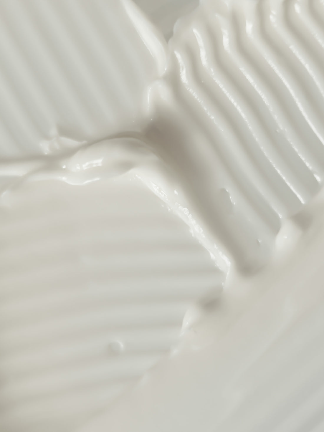 Apothaka comforting moisturiser fragrance free texture, showing a medium weight cream coloured soft texture
