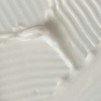 Apothaka comforting moisturiser fragrance free texture, showing a medium weight cream coloured soft texture