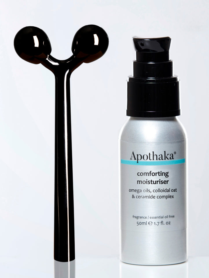 Apothaka self care set with metal facial massage roller and comforting moisturiser