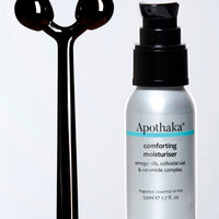 Apothaka self care set with metal facial massage roller and comforting moisturiser